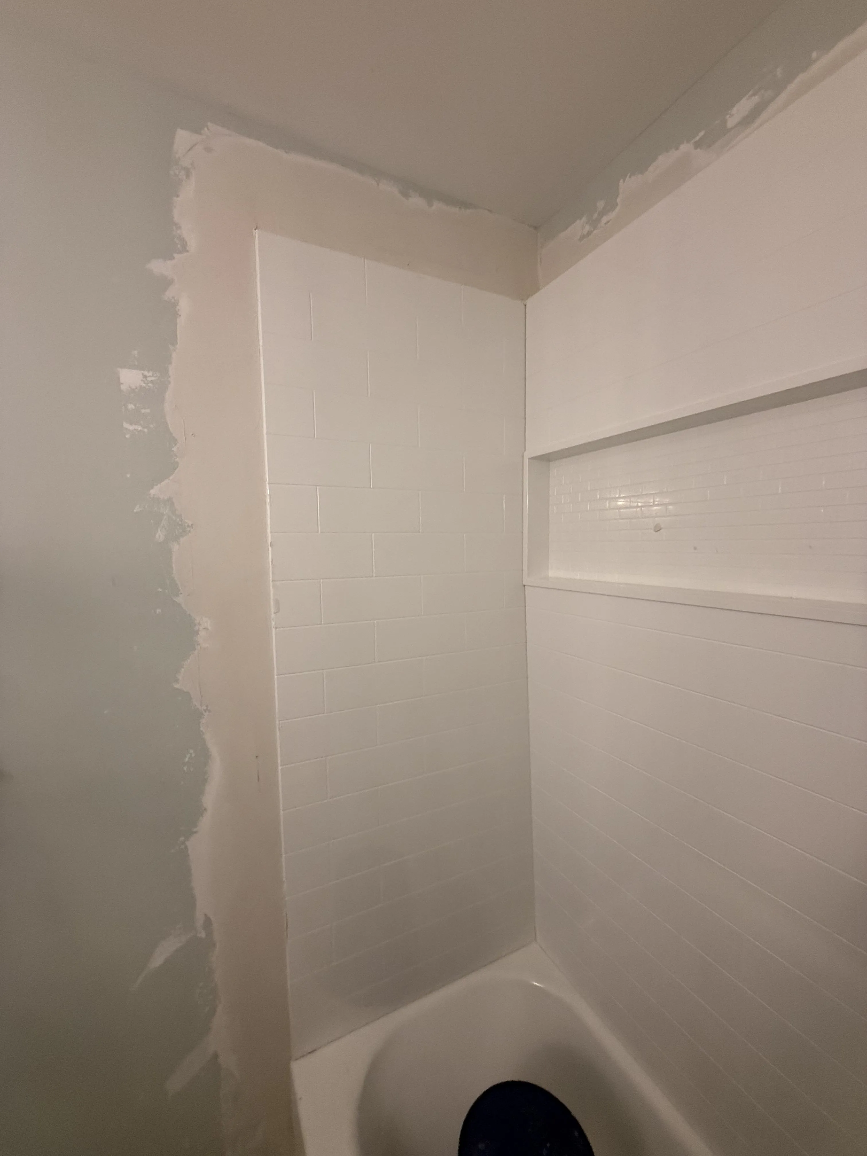 A finished and repainted wall after Carolina Pro Restoration completed a drywall repair