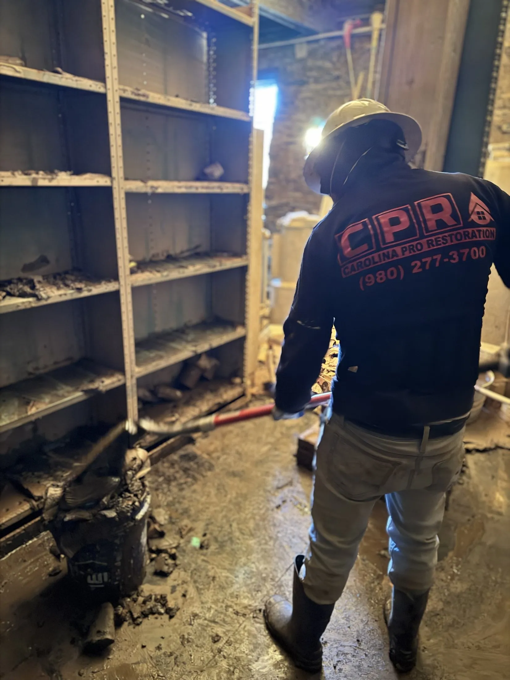 Technician working in a flooded lower level