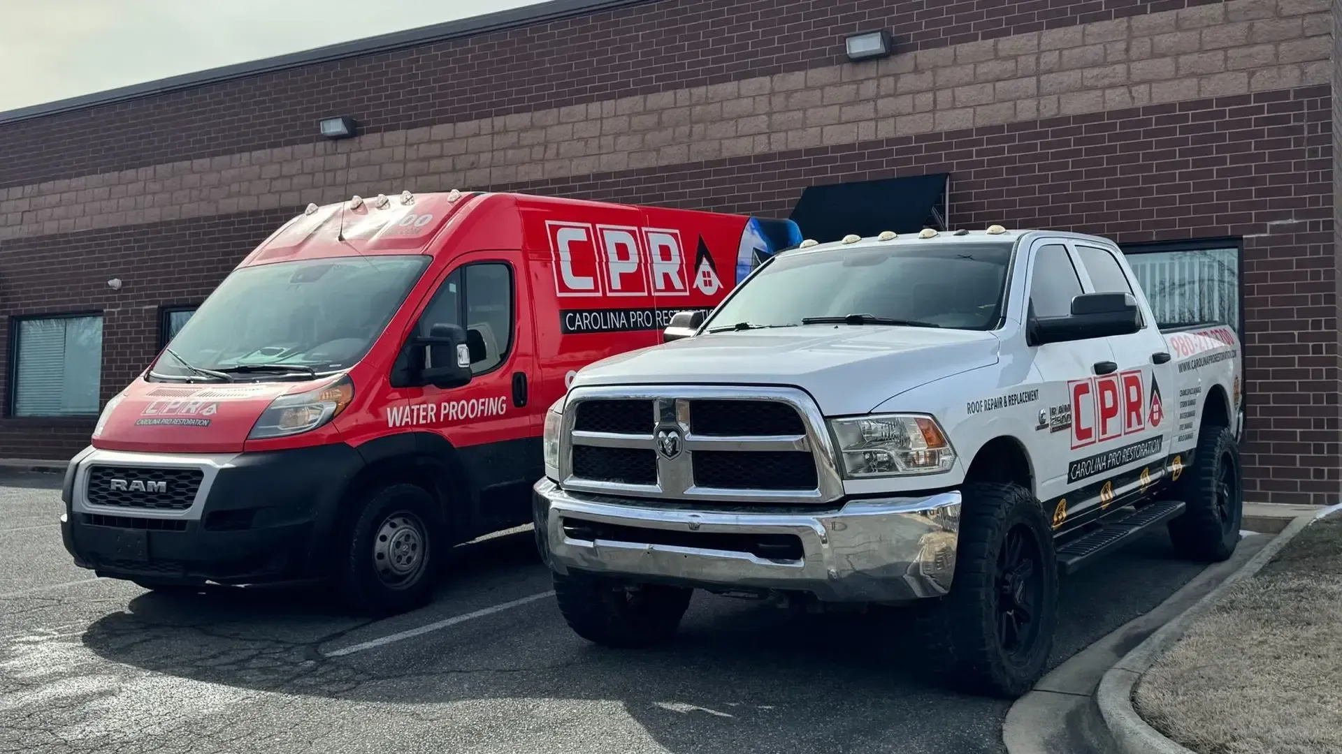 Carolina Pro Restoration branded truck and water-proofing van at the Fort Mill office