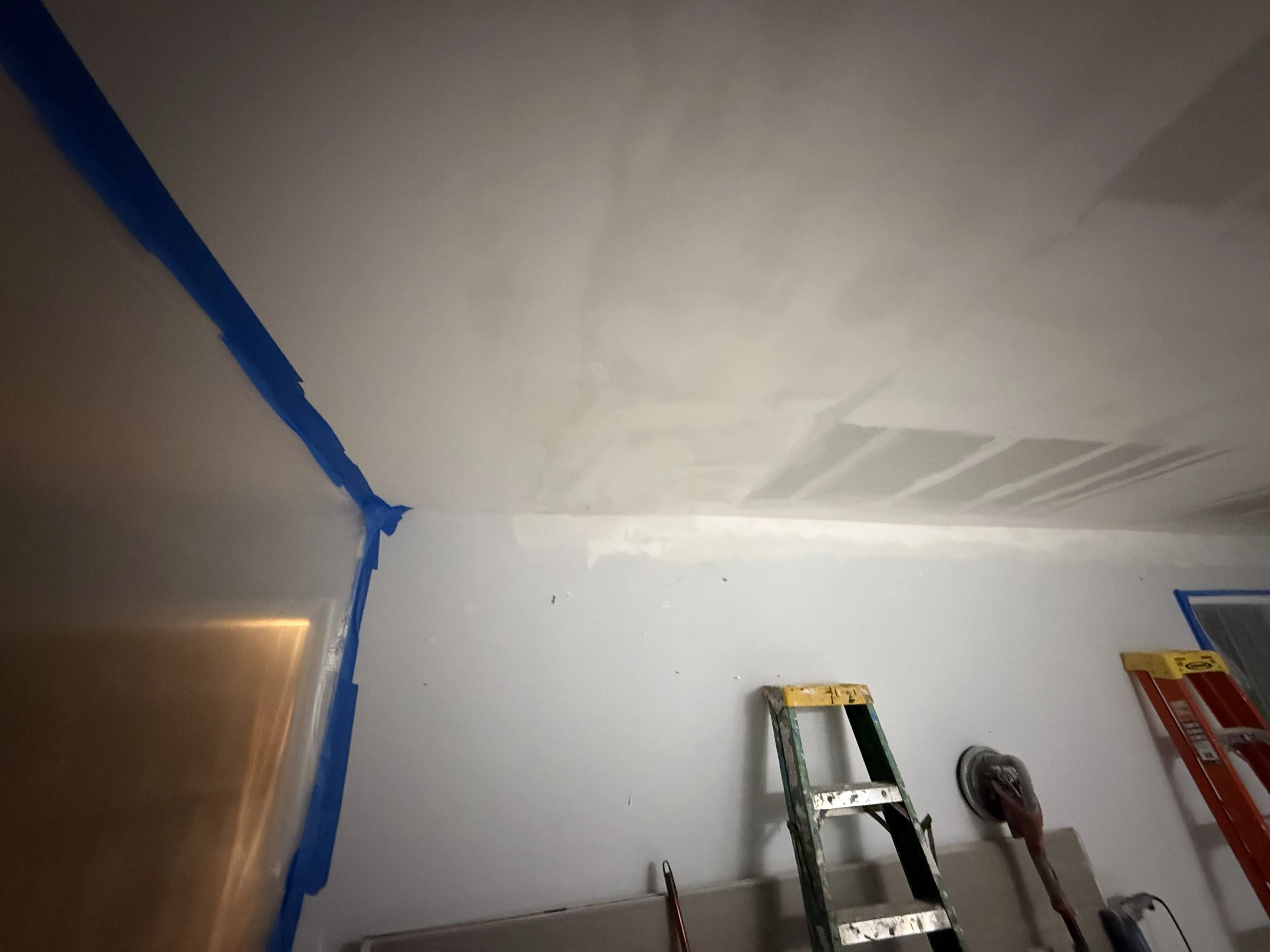 A room masked and taped in preparation for interior painting by Carolina Pro Restoration